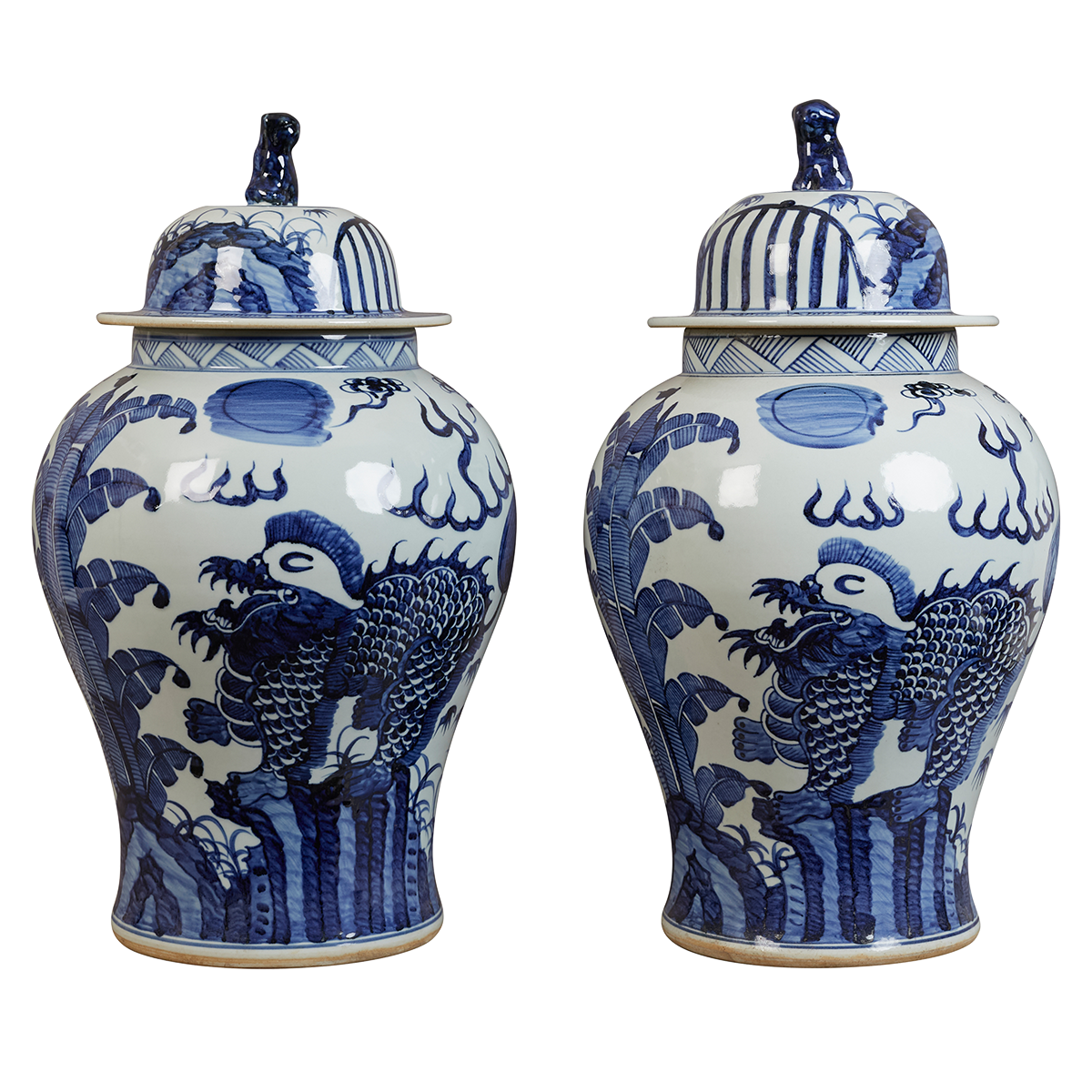 A pair of contemporary blue and white Chinese-style lidded jars with stylised phoenix birds