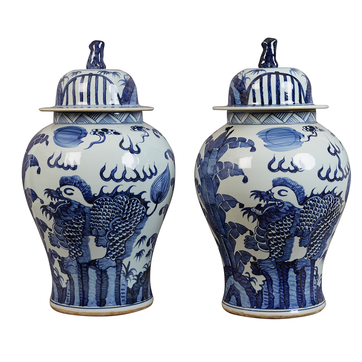 A pair of contemporary blue and white Chinese-style lidded jars with stylised phoenix birds