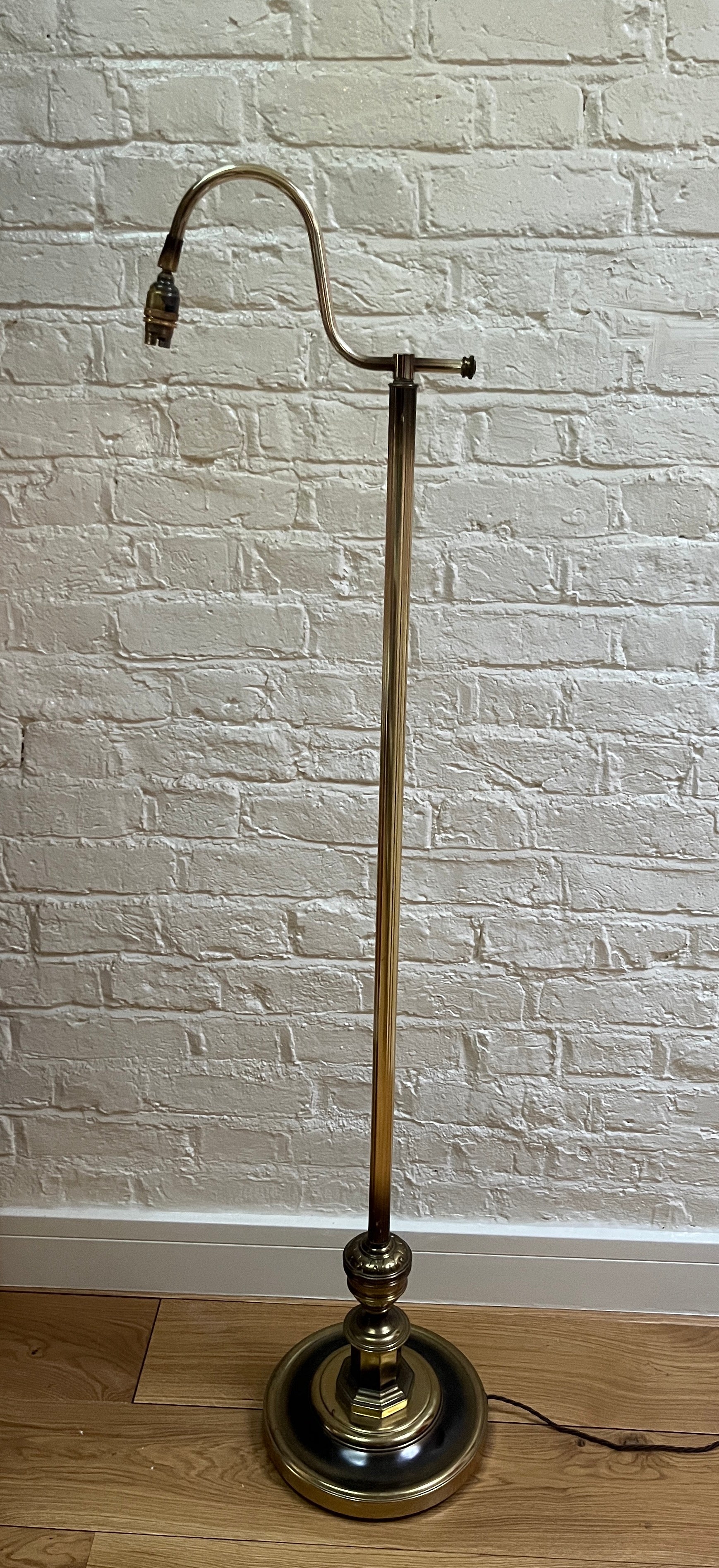 A pair of late 20th century brass effect floor standing lamps, electrified