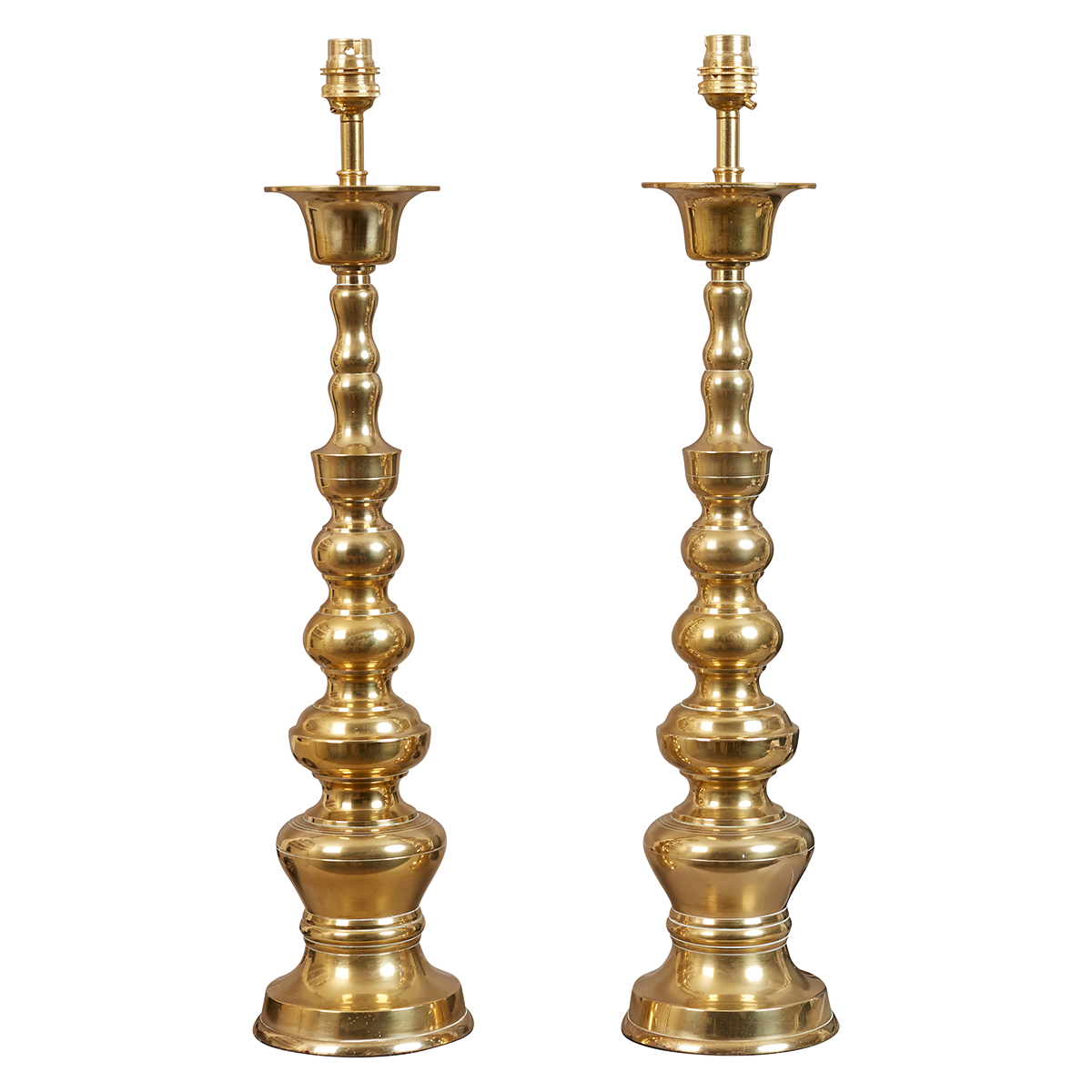 A pair of vintage turned brass lamps converted to electricity