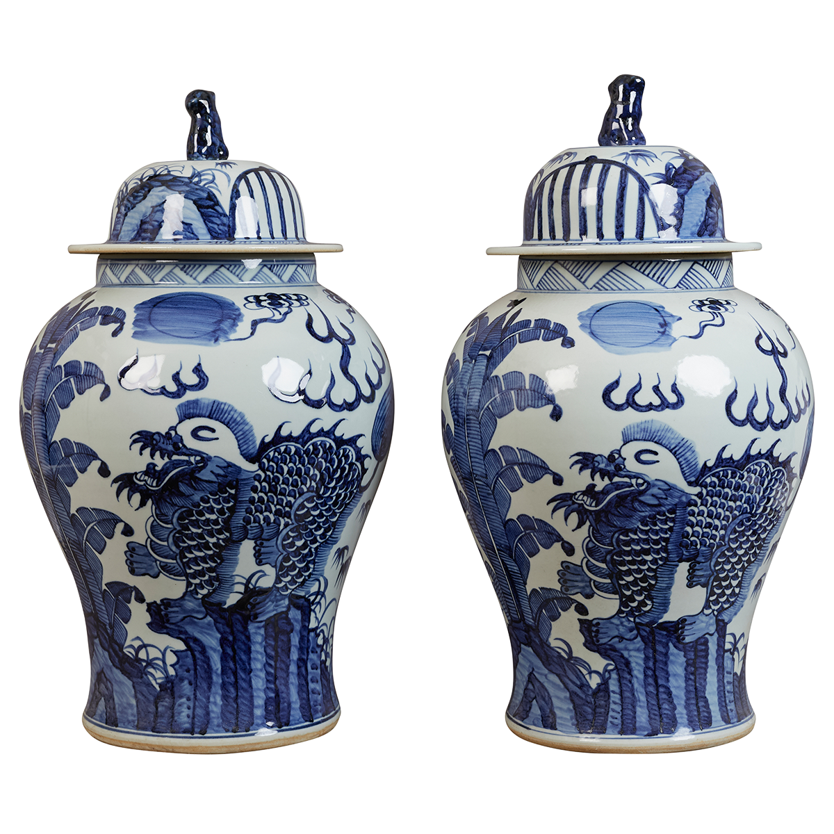 A pair of contemporary blue and white Chinese-style lidded jars with stylised phoenix birds
