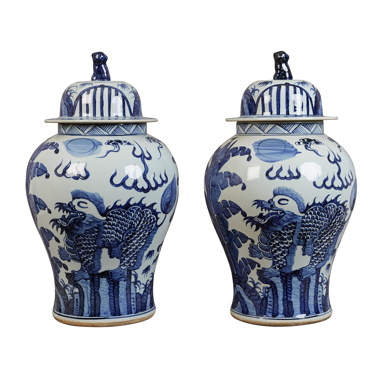 A pair of contemporary blue and white Chinese-style lidded jars with stylised phoenix birds