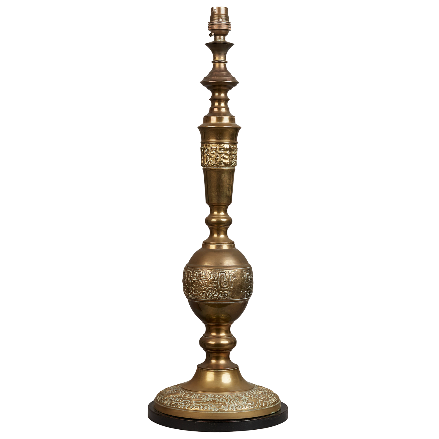 A mid 20th century brass engraved table lamp on turned ebonised base