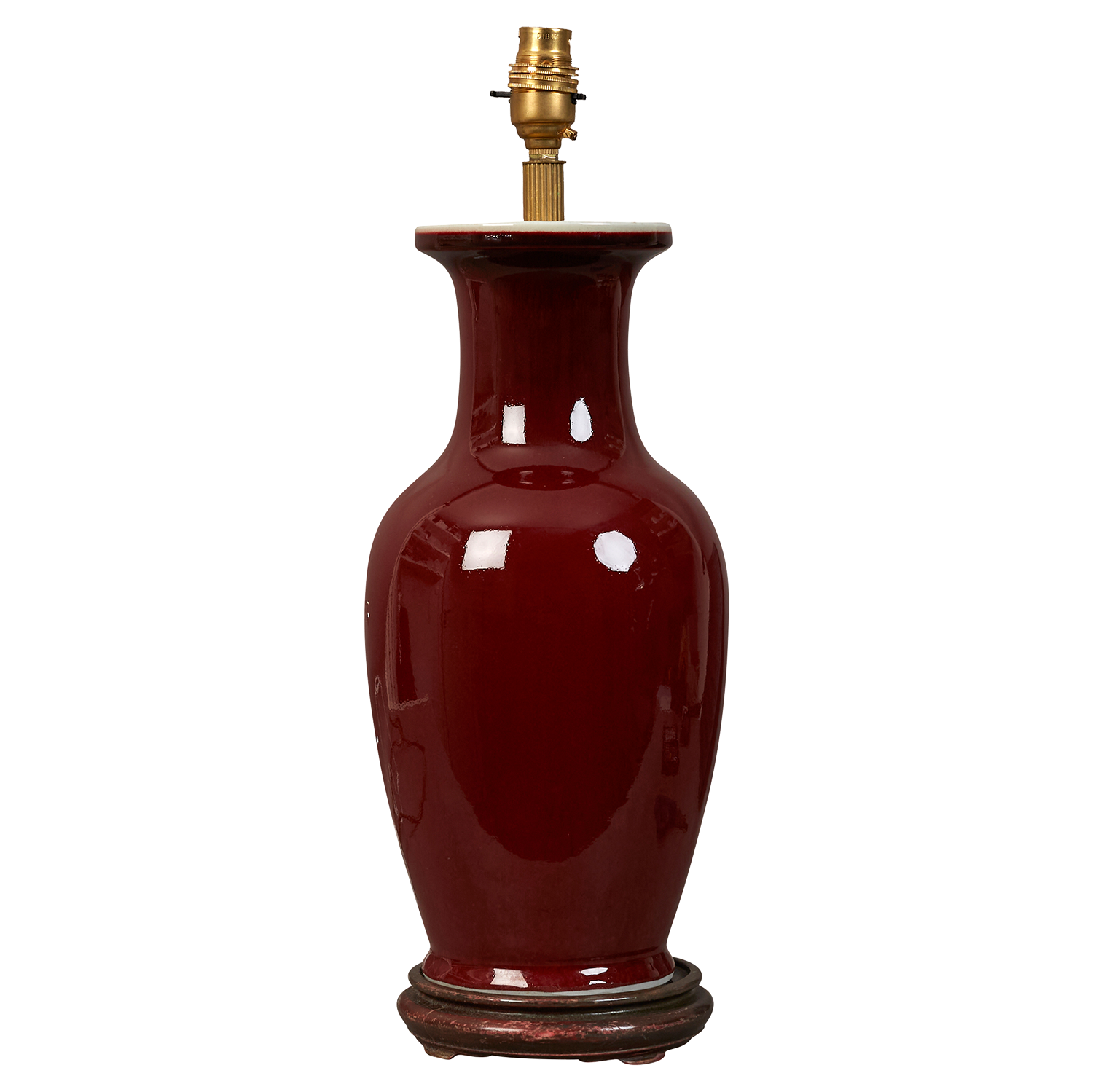 A 20th century sang-de-boeuf Chinese table lamp on turned ebonised base, electrified