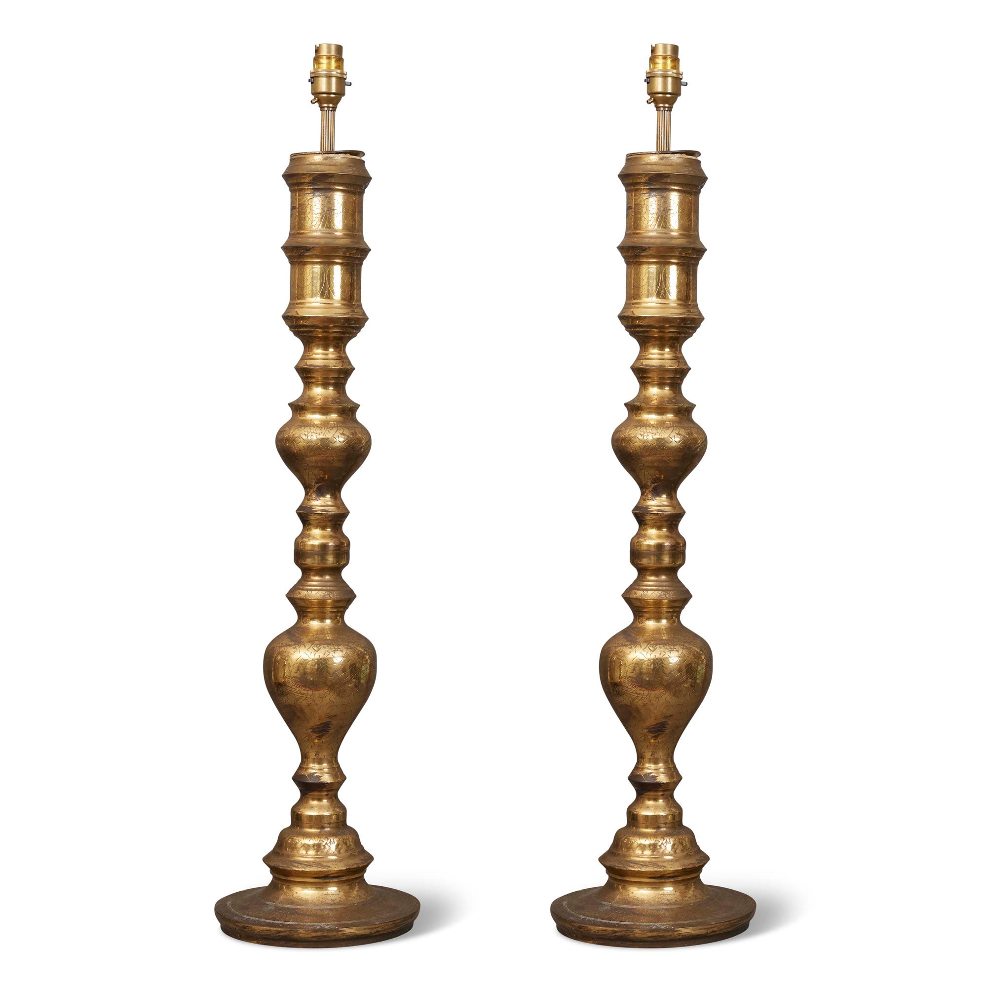 A pair of Indian brass engraved table lamps