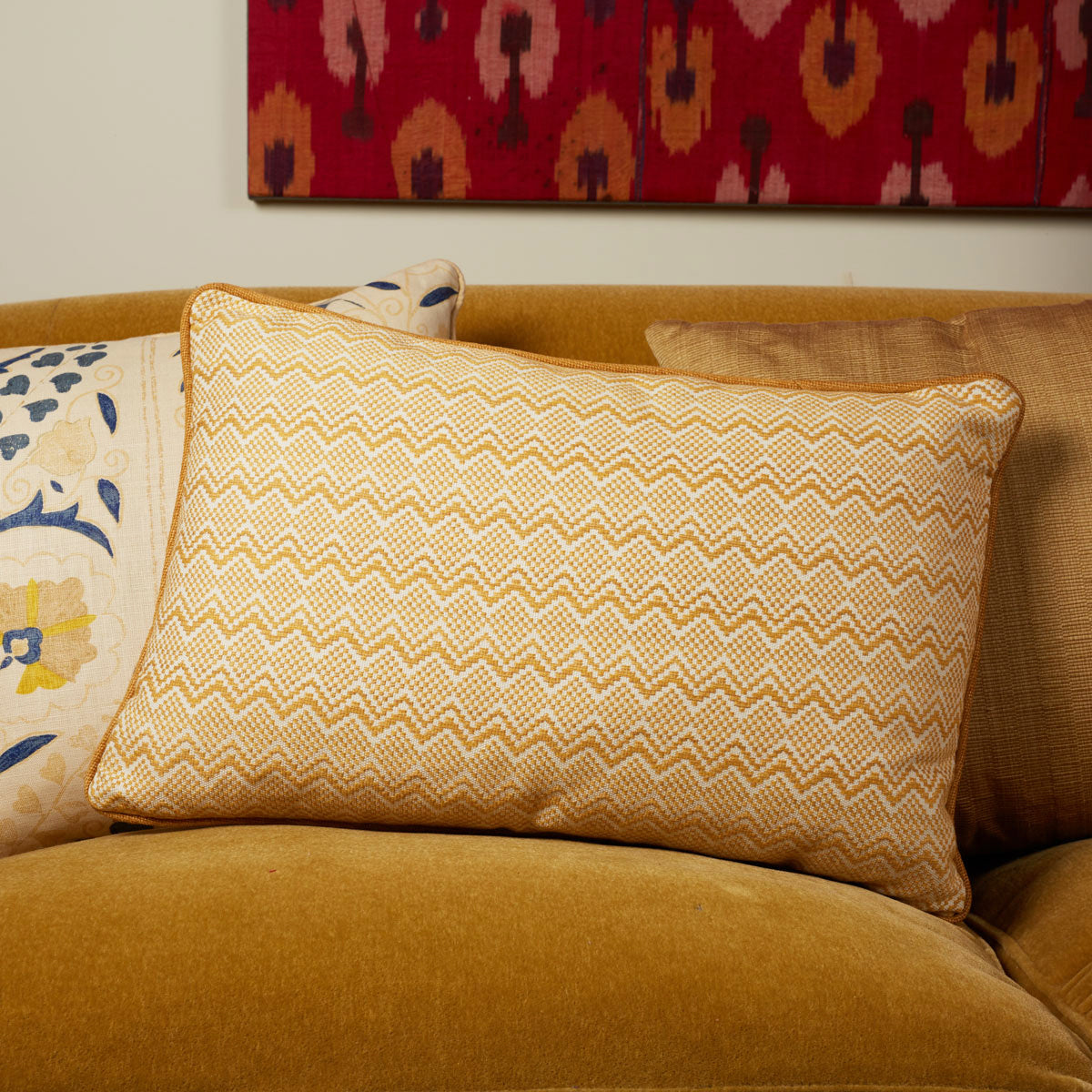 A rectangular cushion in Celestial Diamond weave Gold by Soane Britain