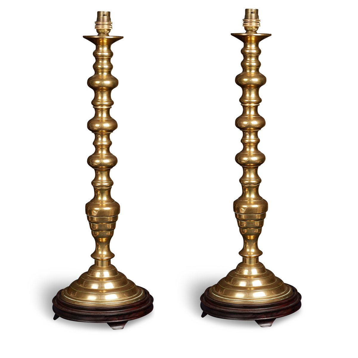 Nushka Lighting A pair of early 20th century turned brass table lamps