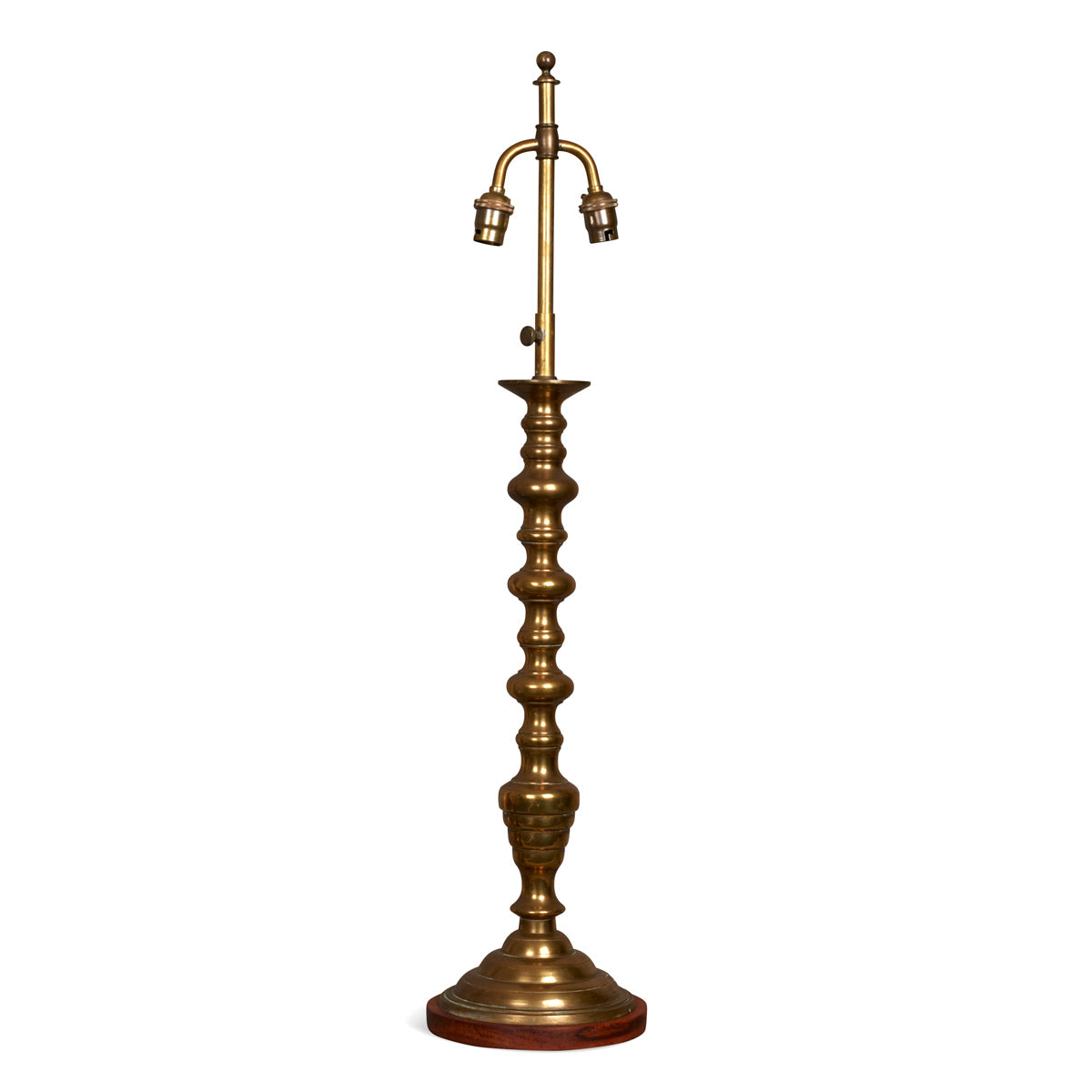 Nushka Lighting An early 20th century brass turned lamp on wooden base